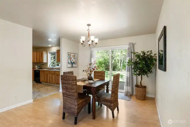 Dining leading to sliding glass doors to enjoy your large, private backyard and deck.