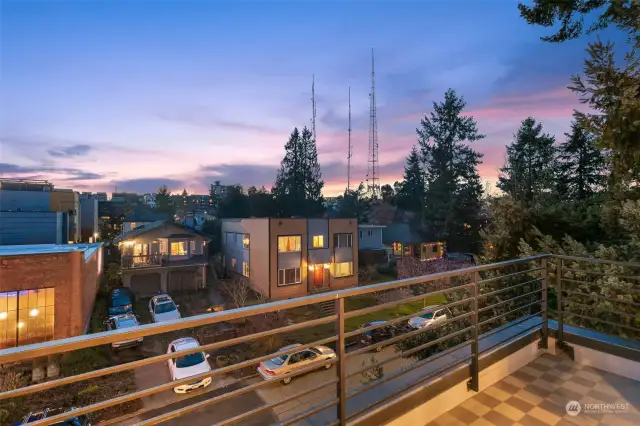 Accessible from the primary suite level, this private west-facing balcony is the perfect place to sip your morning coffee or enjoy gorgeous PNW sunsets.
