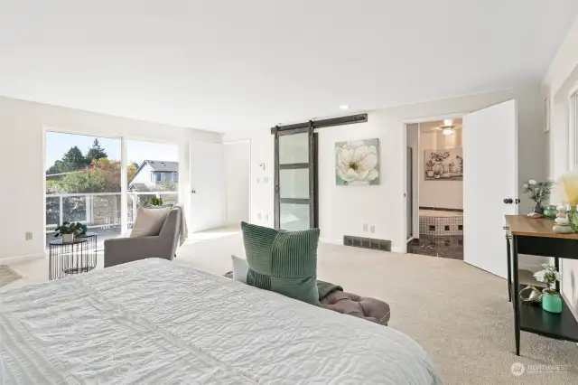 Big sliding doors out to deck give lots of natural light to the bedroom.
