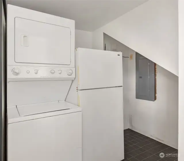 Washer/dryer and extra refrigerator, plus storage on lower level.