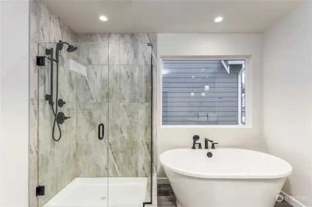Shower and tub in Primary suite.
