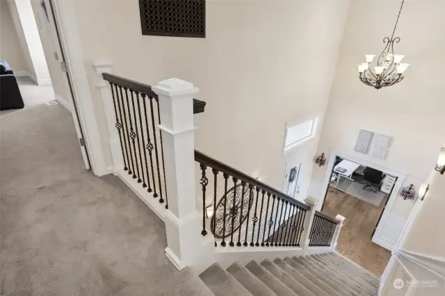 Open staircase, wrought iron spindles & soaring ceilings as you enter through the front door.