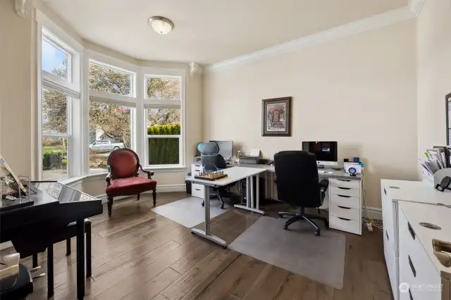 French doors to the left of the front door guide you into the office. Lots of natural lighting, 10ft ceilings, crown molding & trim work make this area the perfect location to work from home but still feel like you are away from the house.