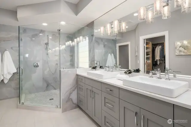 Lavish primary bathroom with heated floors and extended shower