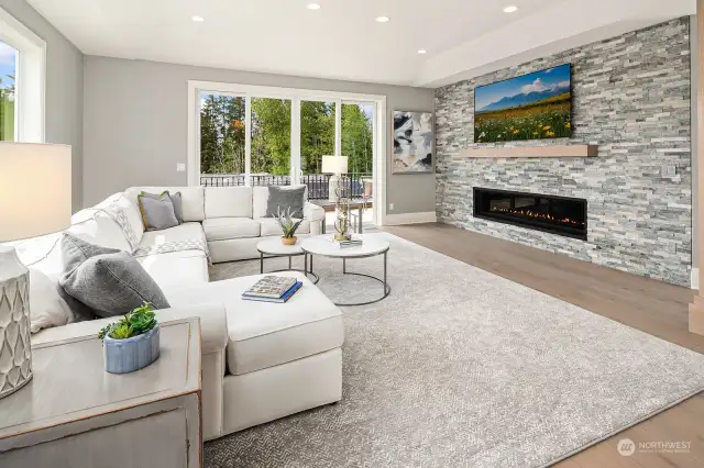 Grand living space with stone wall and Xtrordinair ProBuilder gas fireplace spans six feet wide with light controls