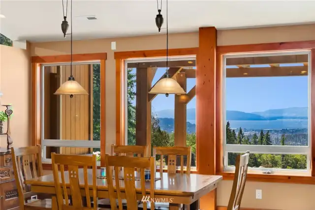 Dining room with views & vaulted ceilings.