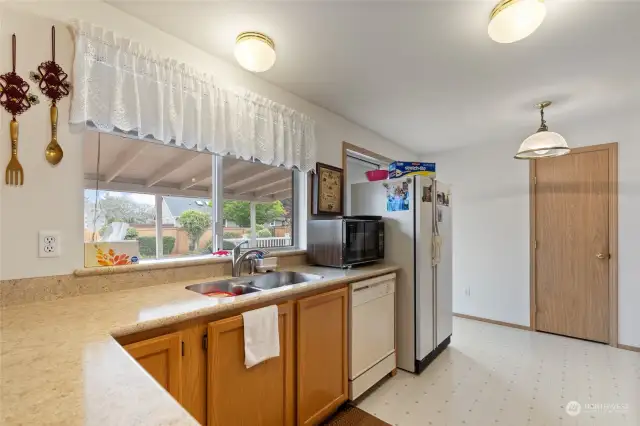 Separate eating area off kitchn with sliding doors to outside covered patio