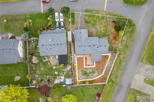 Great aerial photo showing the corner lot and front and backyard