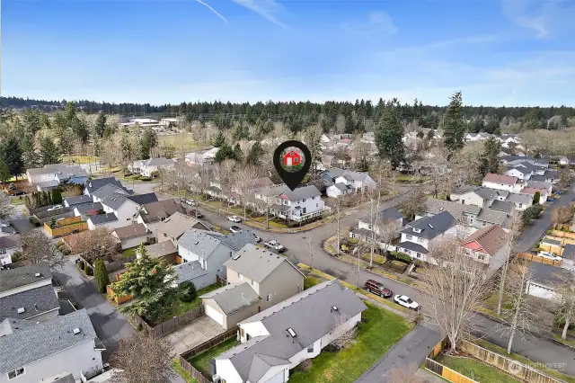 Aerial view of neighborhood with house location pinned.