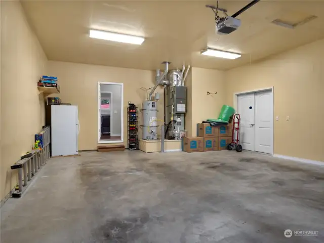 From the laundry room, enter the garage. Through the double doors to the right leads to the 3rd bay of the garage. TONS of space!