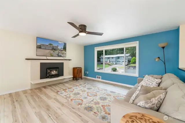 Bask in the abundance of natural light & enjoy designer color accents throughout home. Wide LVP flooring for ease of care and durability. Woodstove insert add coziness & economical secondary heat.