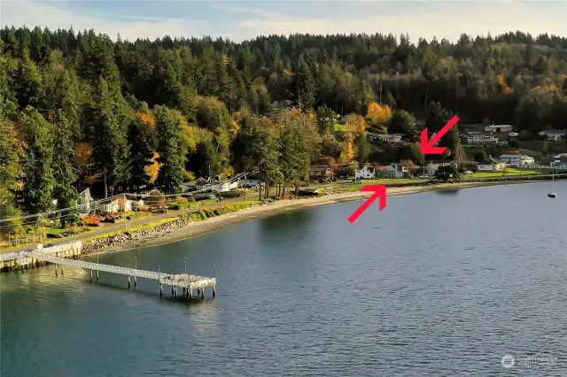 Waterman dock in the foreground and the arrows point to the property, showing proximity to the public dock.