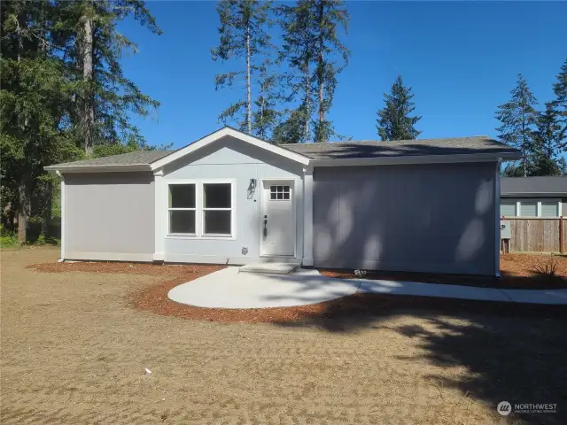 Front of home with circular concrete porch