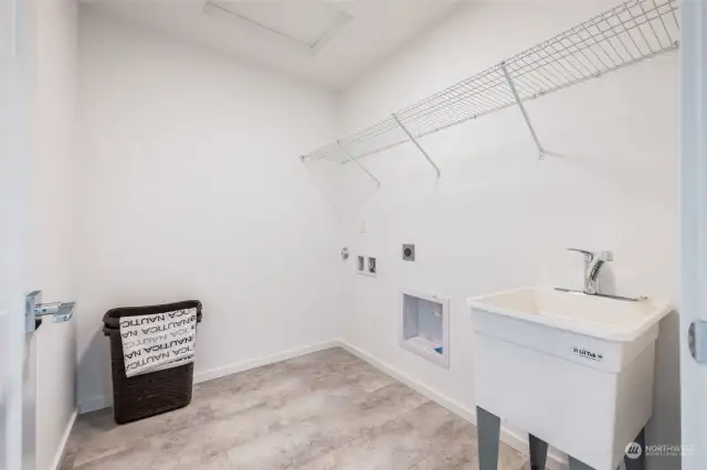 Sizable laundry room with sink.
