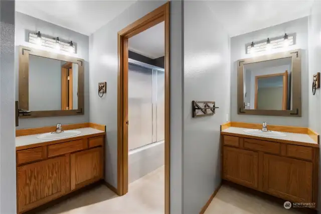 Full bath with separate vanities and private shower room!