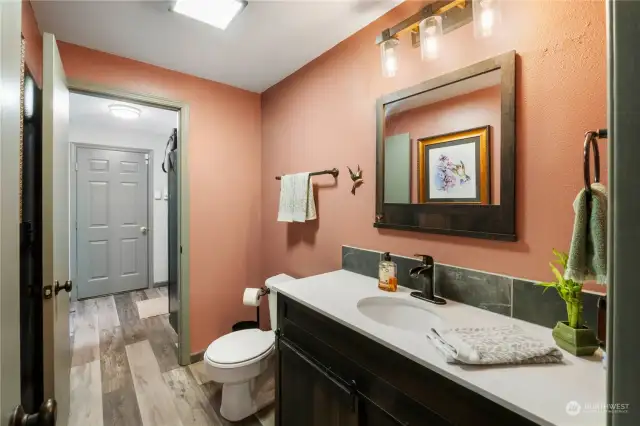 Conveniently located and generously proportioned half bath.