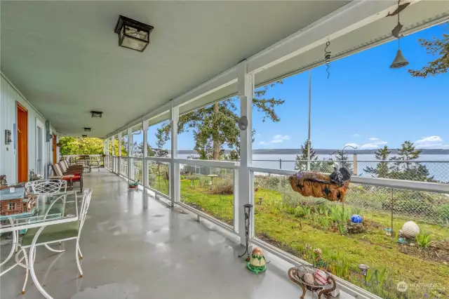 Full west side length of this home offers a covered deck for morning coffee with the eagles soaring to evening wine with the everchanging landscape of Saratoga Passage and the Olympics.