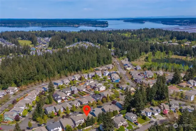 Tucked away within a picturesque golf club community near the South Puget Sound, this home offers both beauty and convenience in its serene surroundings.