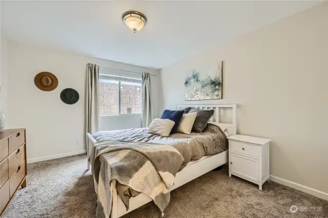 Spacious primary bedroom with walk in closet and en suite