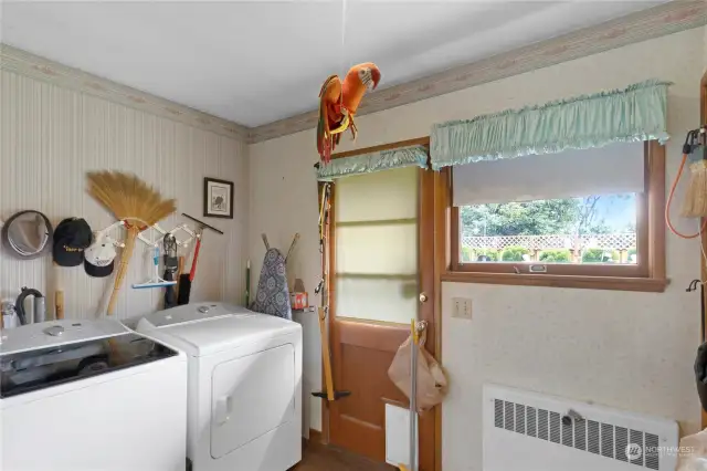 Laundry Room with door leading to backyard.