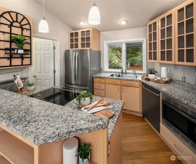 Gleaming granite countertops, a well-stocked walk-in pantry, and modern appliances await your culinary creations.