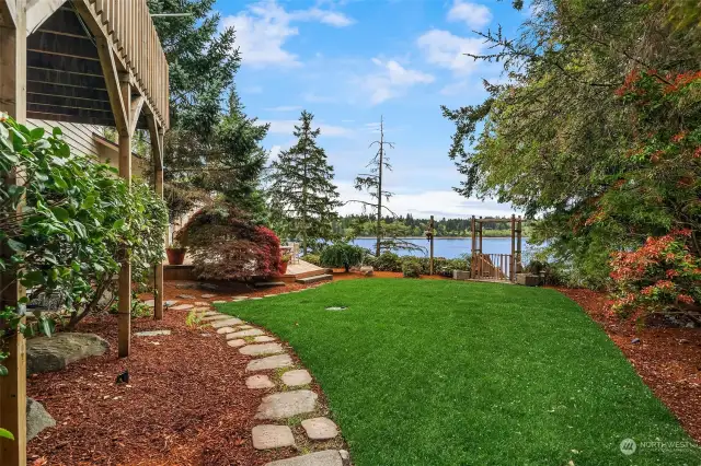 This waterfront paradise extends beyond the breathtaking views! Immerse yourself in the beauty of an expansive garden, your perfect space for relaxation, entertaining, or simply soaking up the outdoors. And to fuel your green thumb, a convenient shed with electricity awaits, ready to energize your next gardening project.