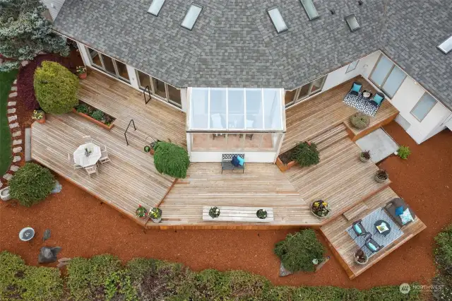 The expansive deck provides the perfect platform for both vibrant gatherings and tranquil relaxation, with the option for a future hot tub on the dedicated pad.