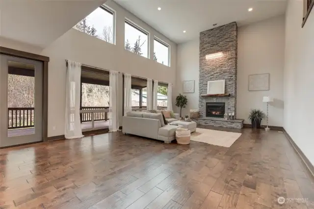 Check out this great-room with 24 foot Soaring ceilings and oversized windows that flood the space!