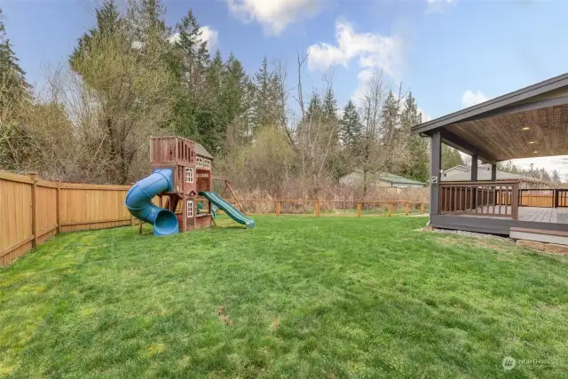 Dream backyard with play area & gate that leads to the private woodland adventure land complete with creek, frogs & more!