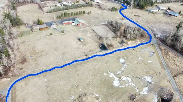 View showing how to access the property for showing.  You will see the sign at the bottom left.   Walk south along the fence line to the property.  There is also a drawing in supplements that shows this.  On the far right/middle will be the road to the home when completed.