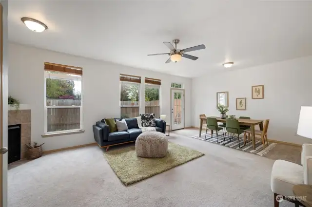Freshly painted, with 9' ceilings and extra tall windows, the living room is bright and filled with light. The back door leads out to the fully fenced in back patio.