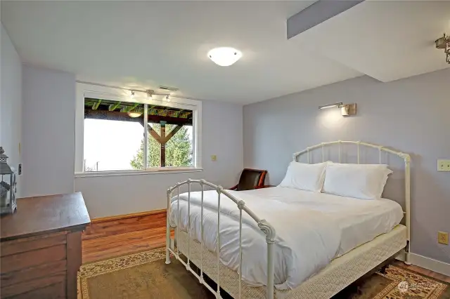 Downstairs guest bedroom, large window to take in the views or sunset.