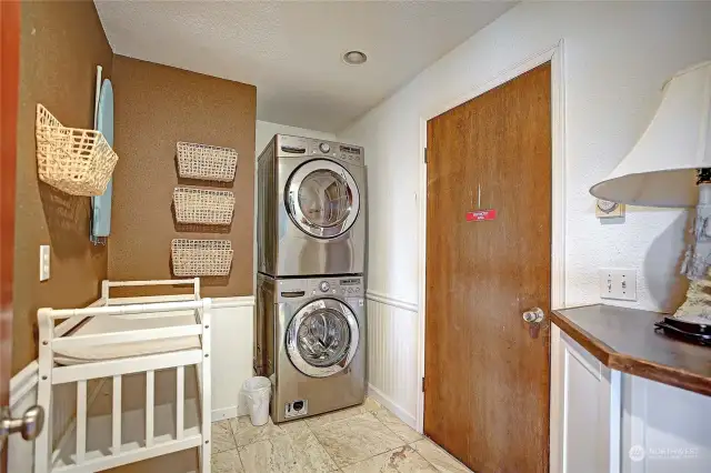 Upstairs laundry room with easy garage access.