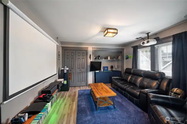 The third bedroom has been transformed into a versatile theater room, offering a flexible space to unwind and entertain.
