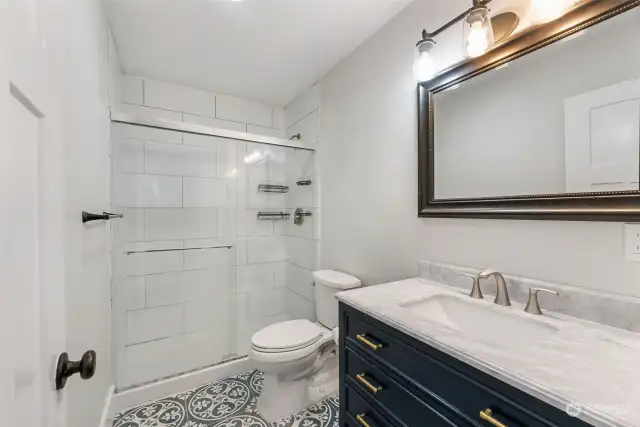 Primary Bath w/tiled shower and heated tile floors.