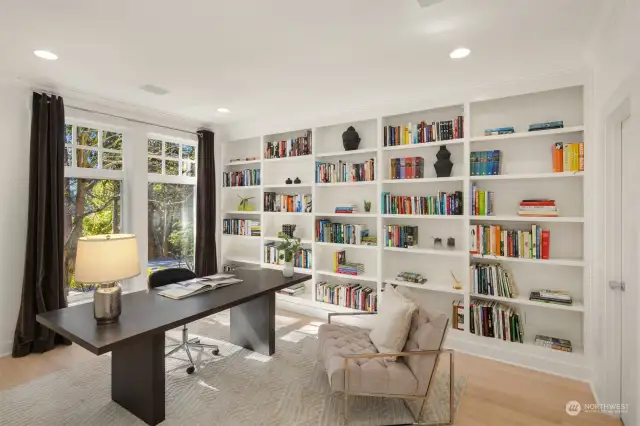 Home office with library wall.