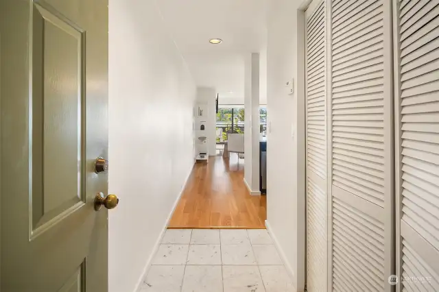 Entrance with utility and coat closet on the right