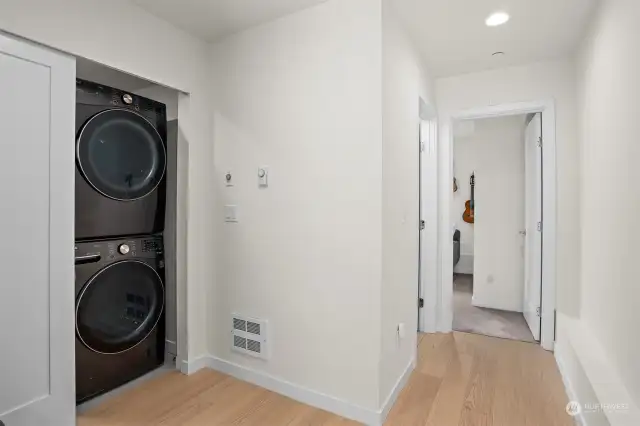 The lowest level also features the full size washer and dryer.