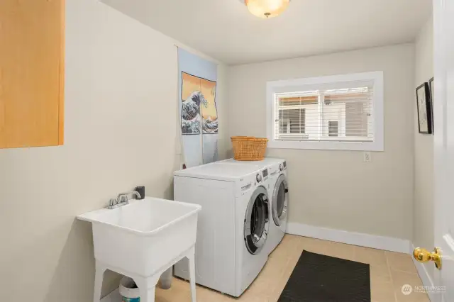 Laundry room with ample storage closest(s). This house has many storage areas and one could be easily turned into a wine cellar.