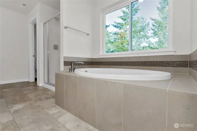 luxurious soaking tub with tile deck