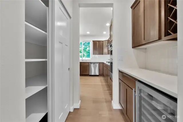 walkthrough butlers pantry with wine rack and beverage cooler standard with this plan!