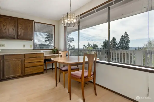 Cozy dining room is just off the kitchen, where you can enjoy your meals while overlooking a beautiful view throught the expansive windows. Sit back, relax, and savor every bite in this inviting dining area.