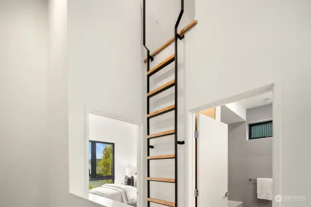 The architectural ladder to the bonus loft provides a modern and stylish touch, adding both functionality and visual interest to the space.