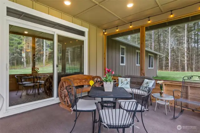 You'll fall in love with this covered screened back porch. It creates an additional 12' x 32' living space for several months of the year.