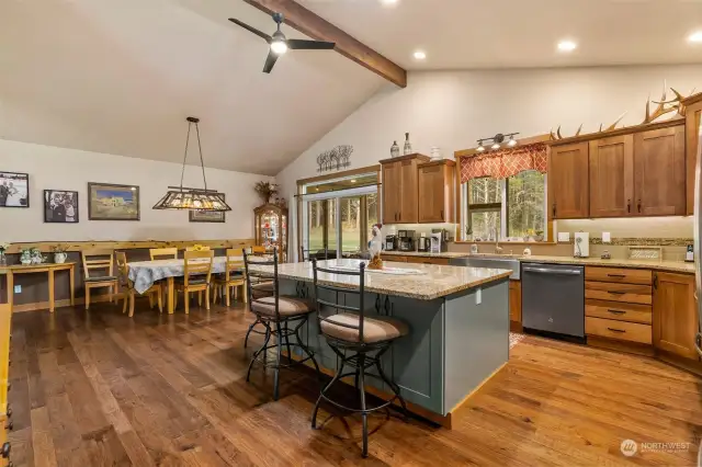 Spacious kitchen is great for gatherings. Cabinets and floor are Hickory.