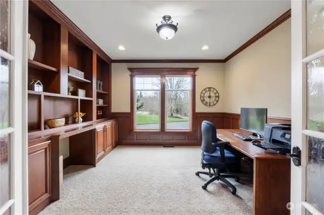 Office faces front of the home and is very light with lots of built-ins. Seeded glass french doors with a transom over the door not pictured.