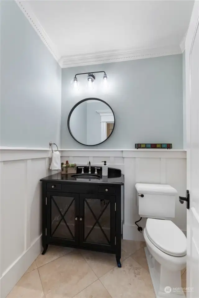Cute powder room with lots of pretty detailing.