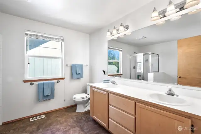 Spacious ensuite master bathroom  with dual sink , soaking tub and shower. Look at the counter space you have in this master bath!
