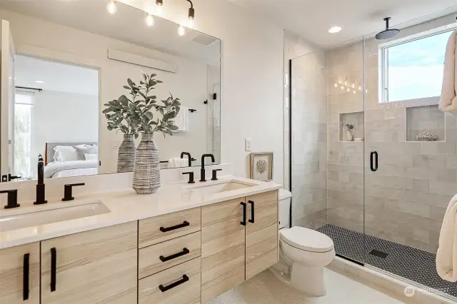 Gorgeous light and bright primary ensuite bath with double vanity and stunning walk-in shower with custom tile and fixtures.