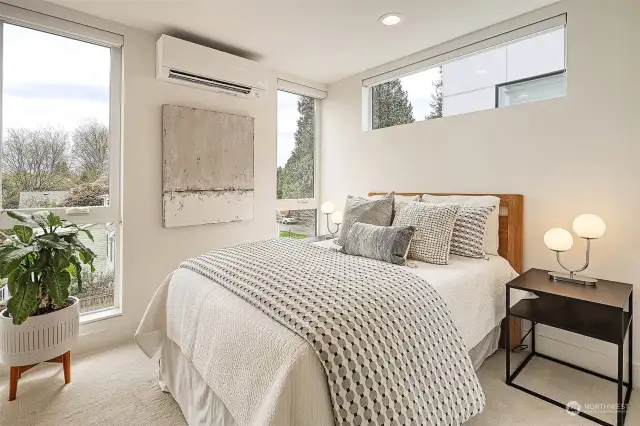 Light and bright fourth bedroom located on the bedroom level features soft carpeting, mini-split, custom California Closets and lovely territorial views.